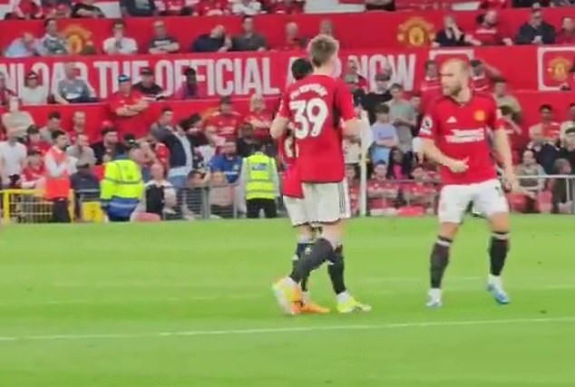 The winger was approached by Scott McTominay (centre right) and Christian Eriksen during the conversation