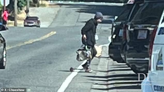 In a surprising turn of events, while the social worker continued to argue with the Seattle reporter about interviewing vagrants, a homeless woman on a scooter (pictured) was seen slashing the philanthropist's tires