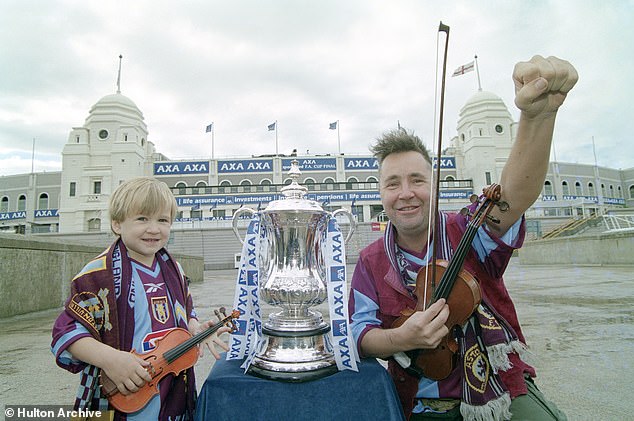 Aston Villa fan Nigel Kennedy and son Sark in 2000. Sark, now 27, was sentenced during Covid when Nigel was in lockdown in Poland, so he couldn't even see his son in court or prison