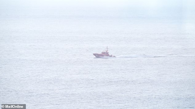 Pictured: The Spanish coast guard on its way to rescue the small boat