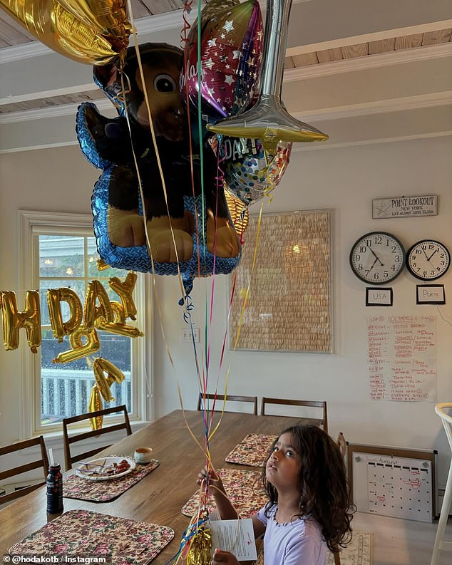 The TV star also shared a snap of four-year-old Hope holding a bunch of balloons in her Long Island home