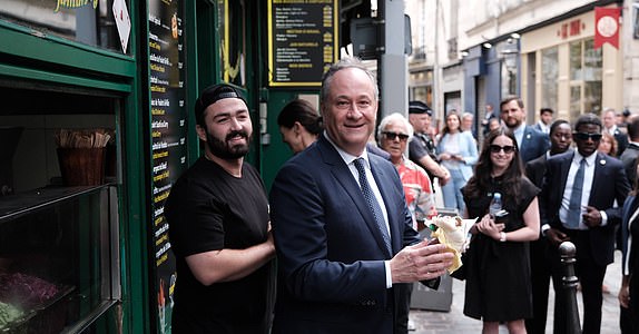 Obligatory credit: Photo by ANTON KARLINER/SIPA/Shutterstock (14629087bd) U.S. Second Lord Doug Emhoff (R) poses with a falafel sandwich after taking part in a ceremony at the site of the so-called 'Rue des Rosiers' or 'Chez Jo Goldenberg restaurant' bombing and shooting at a Jewish restaurant, marking the 42nd anniversary of the Paris attack, on August 9, 2024. The French-Jewish delicatessen restaurant 