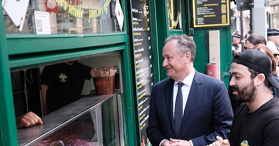 Obligatory credit: Photo by ANTON KARLINER/SIPA/Shutterstock (14629087aw) U.S. Second Lord Doug Emhoff (R) poses with a falafel sandwich after taking part in a ceremony at the site of the so-called 'Rue des Rosiers' or 'Chez Jo Goldenberg restaurant' bombing and shooting at a Jewish restaurant, marking the 42nd anniversary of the Paris attack, on August 9, 2024. The French-Jewish delicatessen restaurant 