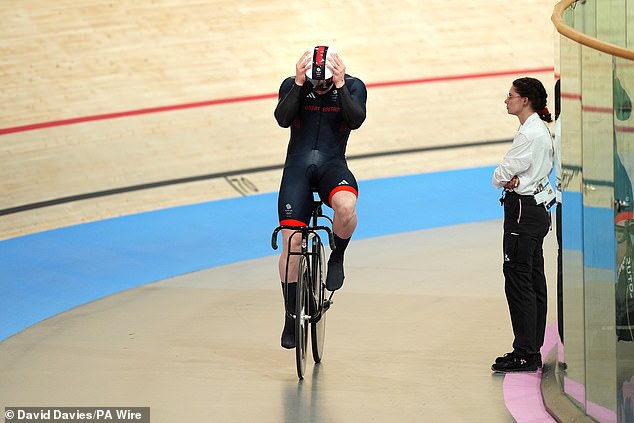 Carlin held his head in his hands after a collision appeared to lead to disqualification