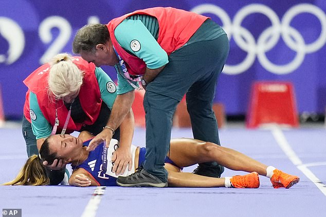 France's Alessia Zarbo receives treatment on the track during the women's 10,000 metres