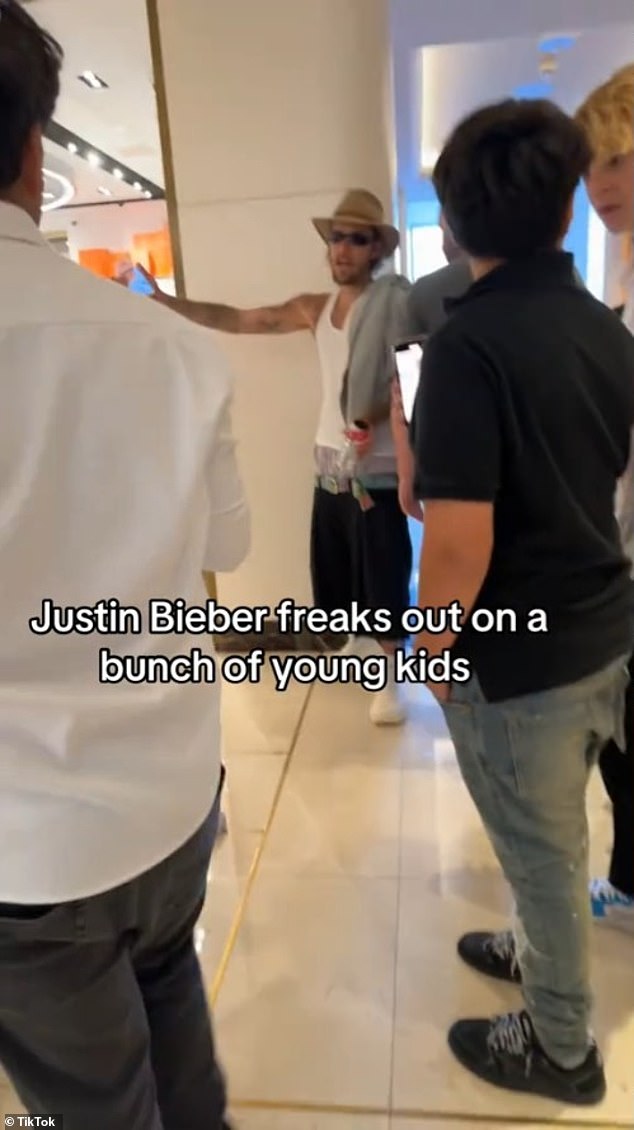 The 30-year-old pop star, looking almost unrecognizable in sloppy clothes, confronts the group of young people in the lobby of the Waldorf Astoria in West Hollywood during the 12-second TikTok