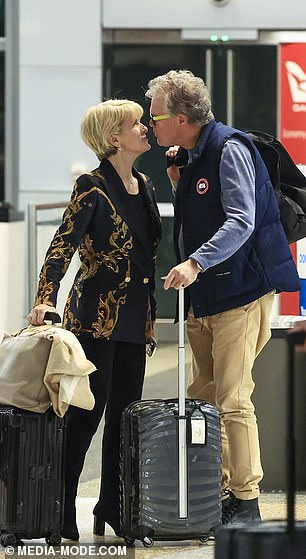 The former Australian politician, 68, was spotted packing on the PDA with her new boyfriend as they arrived at Sydney Airport on Friday