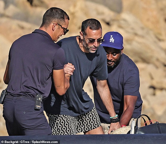 Mohammed was helped out of the boat by the crew