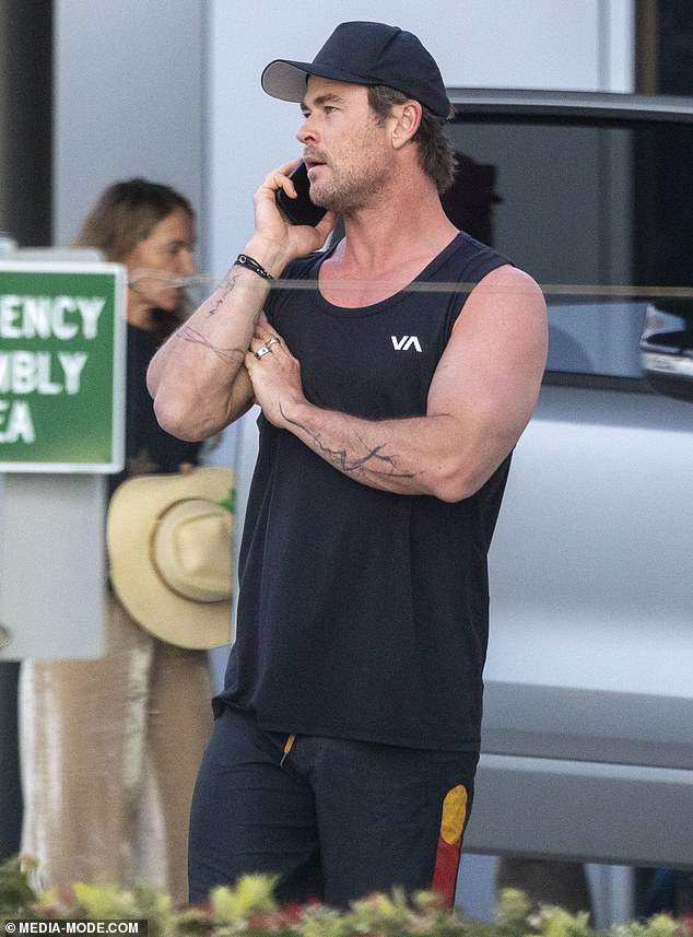 The 40-year-old superstar showed off his muscular arms in a black tank top paired with black pants