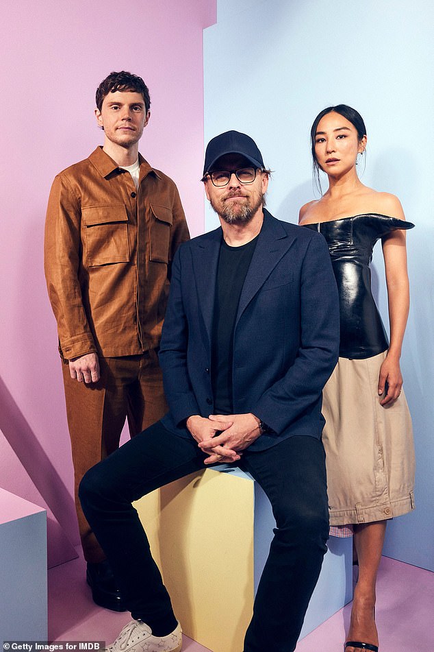 American Horror Story's Evan Peters posed alongside director Joachim Rønning and actress Greta Lee as part of the next Tron movie promotion