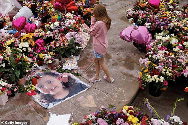 Community members arrive for a vigil in memory of the victims on August 5