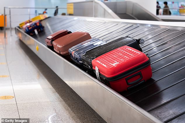 The 57-year-old was found shortly before 8am on Thursday in a restricted area in Terminal 5, where she was found unconscious and 'entangled' in the conveyor belt