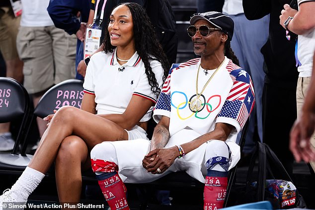 The 52-year-old rapper was joined by WNBA star A'ja Wilson as they sat courtside to watch the US take on Brazil in the thrilling match at the Bercy Arena in Paris.