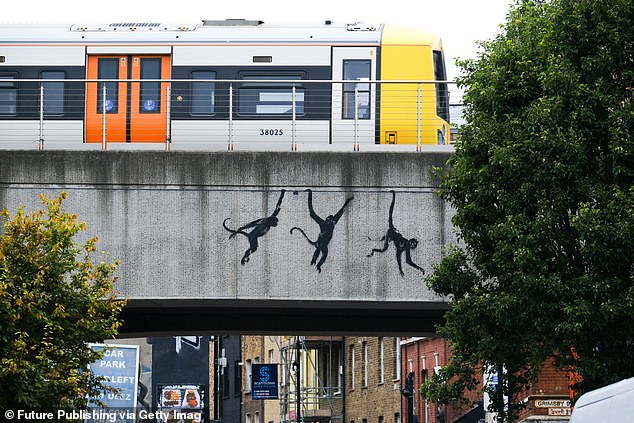 On Wednesday, the artist shared silhouettes of three monkeys on a bridge in East London