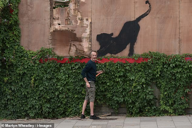 Banksy unveiled his sixth artwork in as many days on his Instagram page at 1pm today, but within an hour an opportunist was caught red-handed trying to pry it off the wall