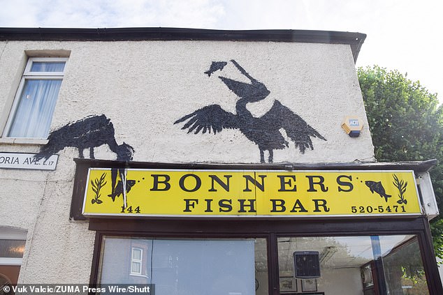 The mural is located above Bonners Fish Bar, on Northcote Road. It is based on a quiet residential street in East London