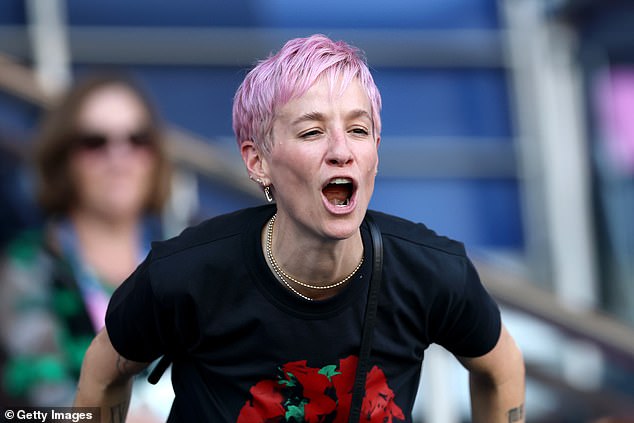 Rapinoe stands alongside American soccer legends Tobin Heath and Ali Krieger