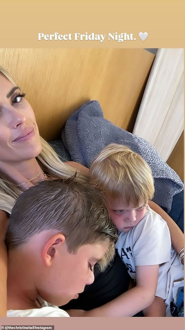 Later in the evening, she uploaded a sweet snap of herself cuddling on the couch with her sons Brayden, eight, and Hudson, four.