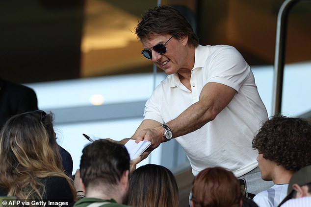 He appeared to be in a cheerful mood during the event, stopping to wave to fans, pose for selfies and sign autographs as a crowd formed around him