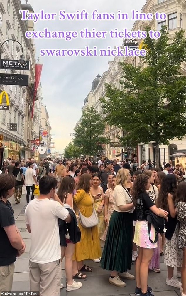 Video on TikTok showed hundreds of fans lining up at a store to pick up their gift, which consisted of a blue stone or a multi-colored pendant on a gray leather cord