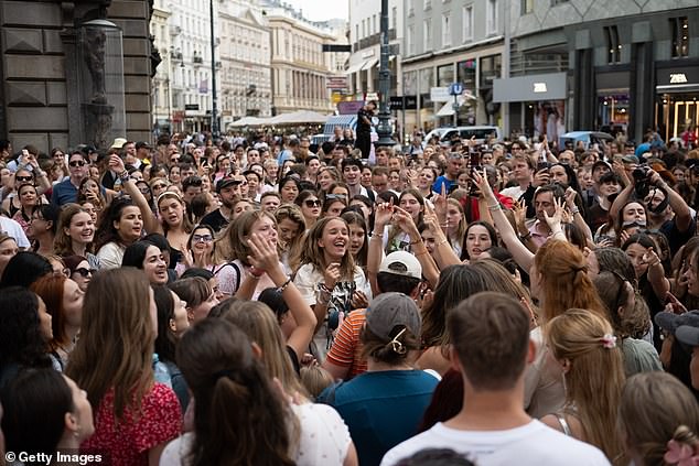 Although disappointed they couldn't attend the shows, fans took to the streets to sing Swift's songs and exchange friendship bracelets (pictured Thursday in Vienna)