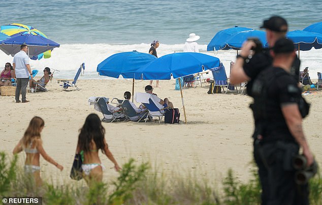 Beachgoers largely left the Bidens alone, though he received a round of applause and met with a few children