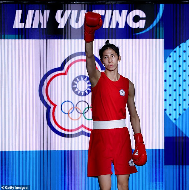 Lin, 28, is pictured waving to the crowd before entering the ring for her gold medal fight