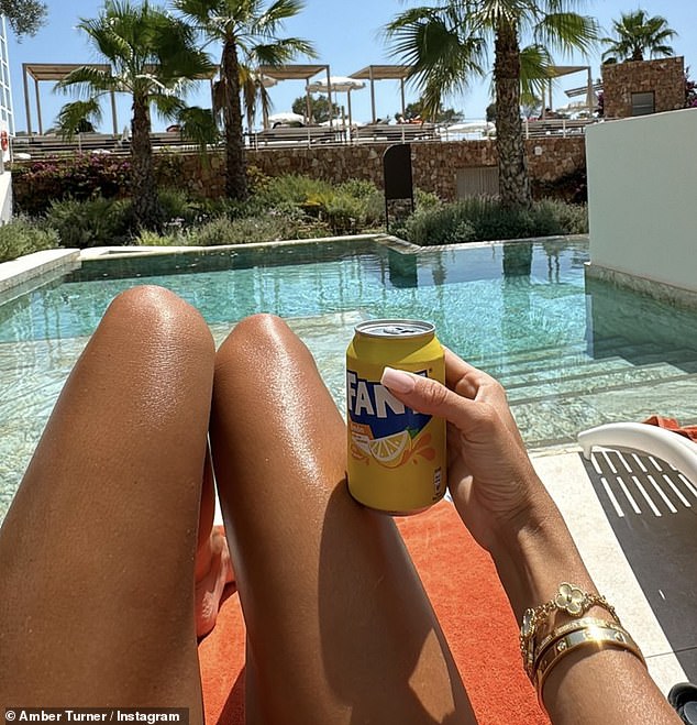 She also posted a photo of her tanned legs and showed off her Cartier and Van Cleef bracelet collection while sipping on a Fanta lemon