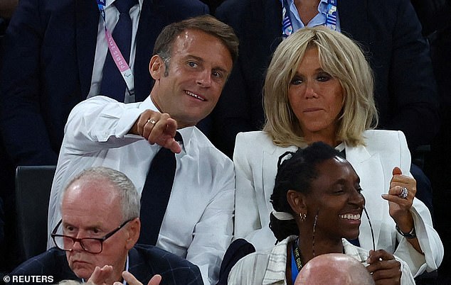 French President Emmanuel Macron and his wife Brigitte Macron watch the France vs. US match