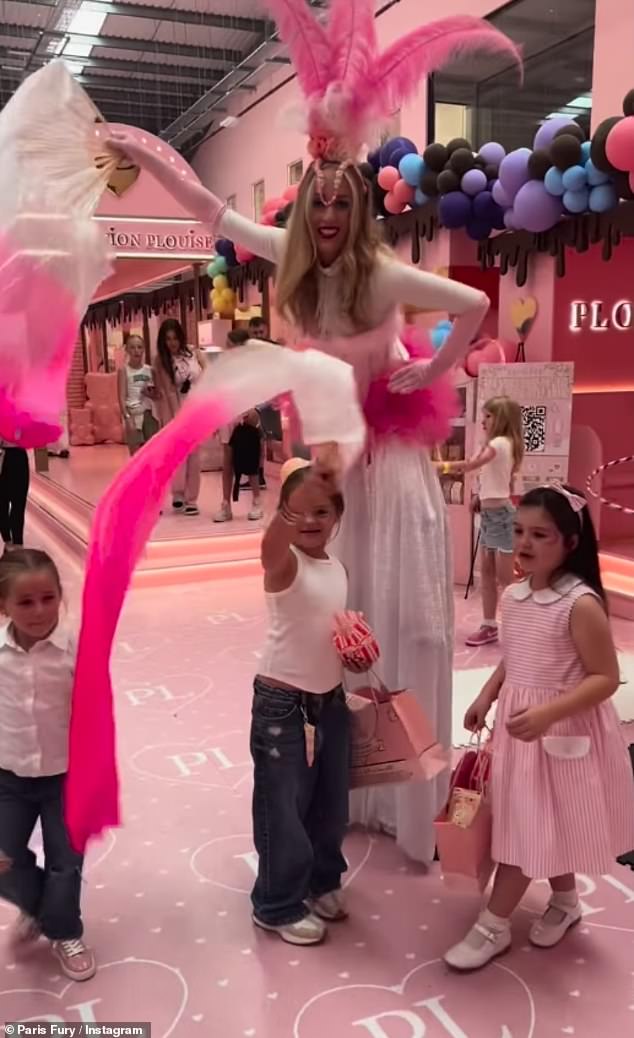 The all-pink venue, which featured huge hot air balloon themed stands, was also decorated with balloon arches as the birthday girl was joined by her friends