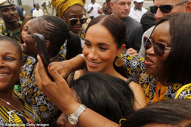 Meghan poses for a photo during an exhibition volleyball match at Nigeria Unconquered, a community-based charity that supports wounded, injured or ill service members, as part of the Invictus Games anniversary celebrations in Abuja, Nigeria on May 11.