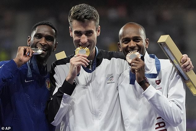 Men's high jump gold medalist Hamish Kerr of New Zealand, center, silver medalist Shelby McEwen, left, of the United States, and bronze medalist Mutaz Essa Barshim