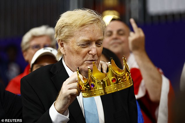 During the race, the Trump lookalike showed off a gold crown as fans watched the pair in action