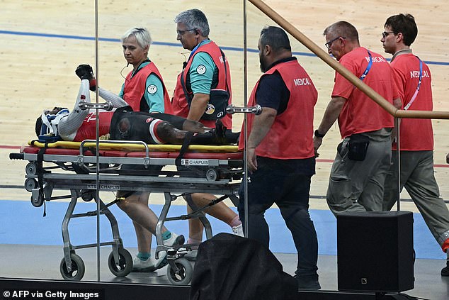 But fans were relieved to see Brown holding his hands up as he was wheeled away on a stretcher