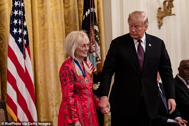 U.S. President Donald Trump awards the Presidential Medal of Freedom to physician Miriam Adelson, wife of Sheldon Adelson, on November 16, 2018