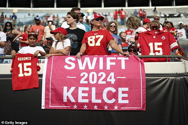 A Kansas City Chiefs fan holds a campaign sign for Taylor Swift and Travis Kelce in the stands prior to an NFL preseason game against the Jacksonville Jaguars at EverBank Stadium