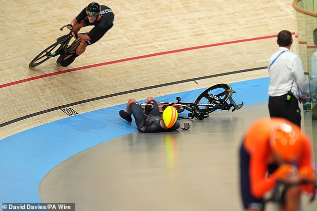 Britain's Ollie Woods ends up on the cycling deck after a collision with a Dutch opponent