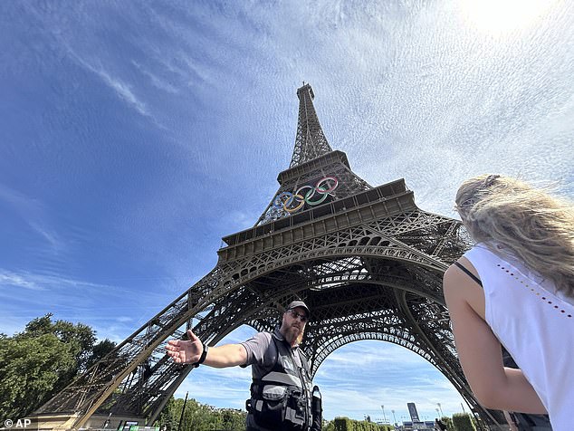 French police lead people away from the tower as they deal with the incident