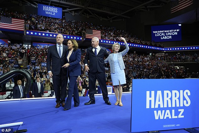 Vice President Kamala Harris, Second Lord Doug Emhoff, Minnesota Governor Tim Walz and Minnesota First Lady Gwen Walz appear at a rally in Philadelphia, Pennsylvania on the day Harris announced Walz as her running mate