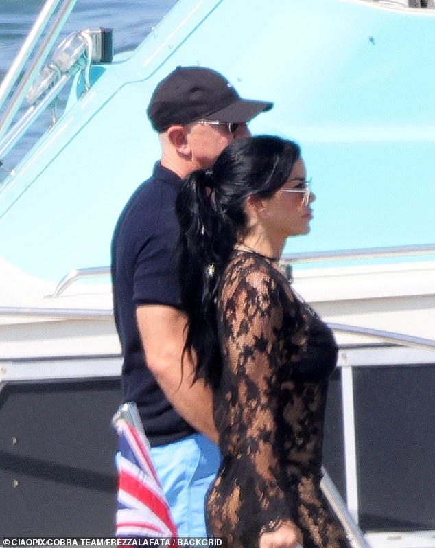 The couple were seen together on a summer day along a boat at a jetty