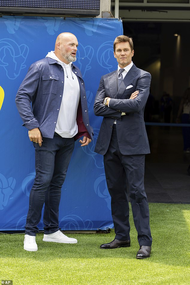 He looked handsome in a navy blue blazer with matching trousers and a polka dot tie