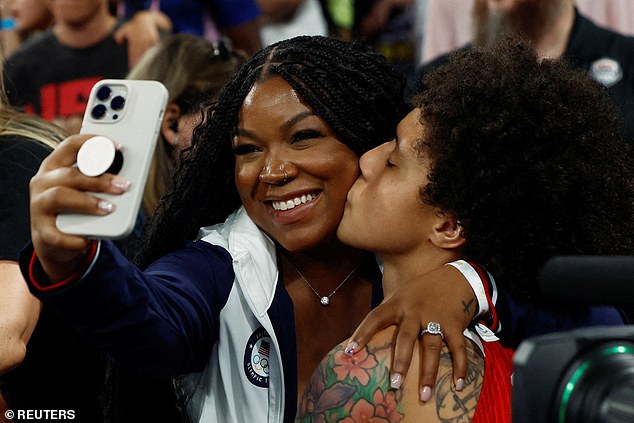 Brittney Griner from the United States kisses his wife Cherelle after winning the gold medal match