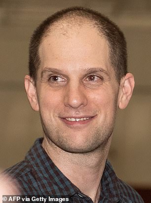 Former prisoner released by Russia, American journalist Evan Gershkovich smiles after landing at Joint Base San Antonio-Kelly Field, Texas, on August 2