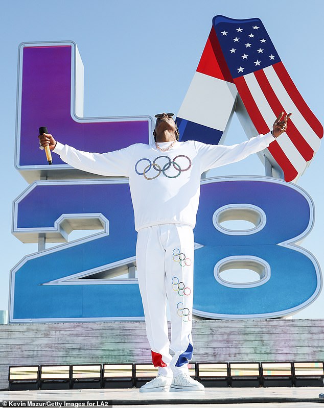 He wore a white Olympic-themed tracksuit for the performance on Venice Beach in his hometown of LA