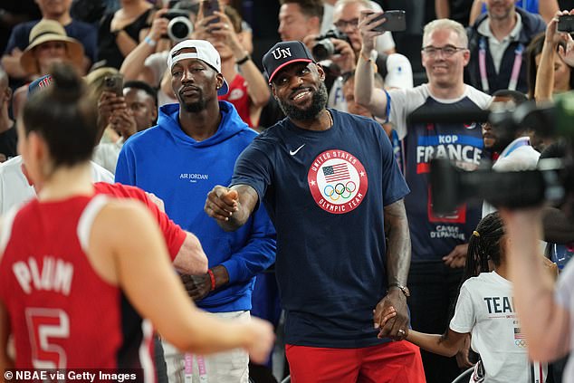 Bam Adebayo and LeBron James (right) watch the US women win gold in Paris