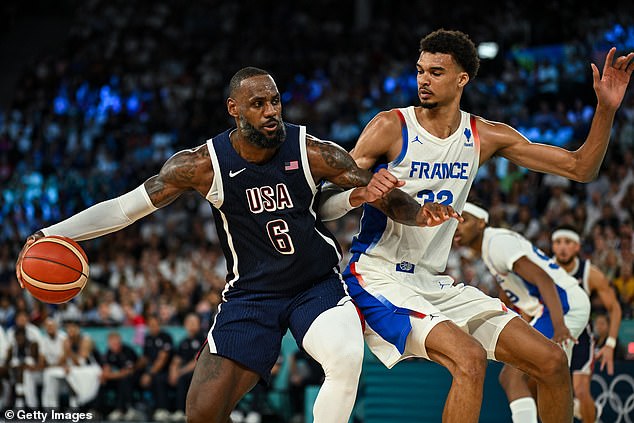 LeBron James blasts into the court against Frenchman Victor Wembanyama in the Olympic final