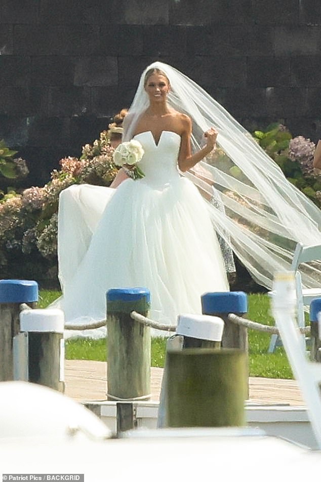 The bride sparkled in a strapless dress with a dropped waist and a full tulle skirt