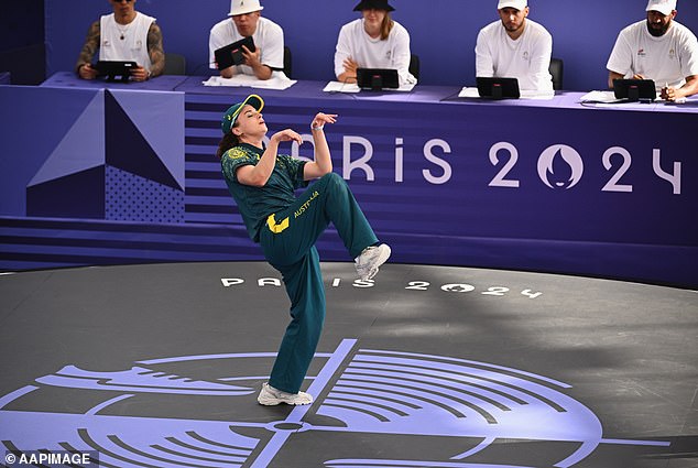 Australian Rachael 'Raygun' Gunn imitates a kangaroo or a T-Rex at the Paris Olympics in a performance that set the internet on fire