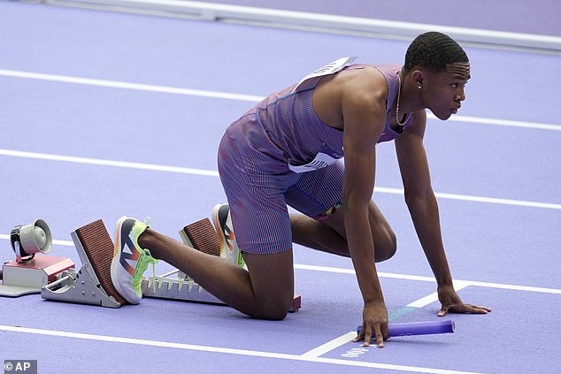 Quincy Wilson of the United States prepares for the start of a men's 4 x 400 meter relay, round 1