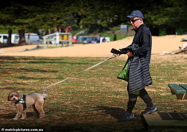 The former CEO was photographed walking his dog on the Northern Beaches, the day after a scathing review accused him of damaging the airline's reputation last week